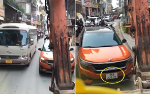 Tài xế máy xúc “ép” xế hộp phải đi lùi vì lấn làn