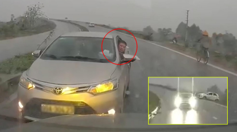 Hình ảnh tài xế xe đi ngược chiều nháy đèn, thò đầu ra ngoài yêu cầu xe đi đúng phải nhường đường.